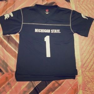 Green Michigan State tee shirt.